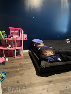 14255 Barolo Way Beaumont, CA 92223 - Photo 7 of 22 a bedroom with a bed and a table