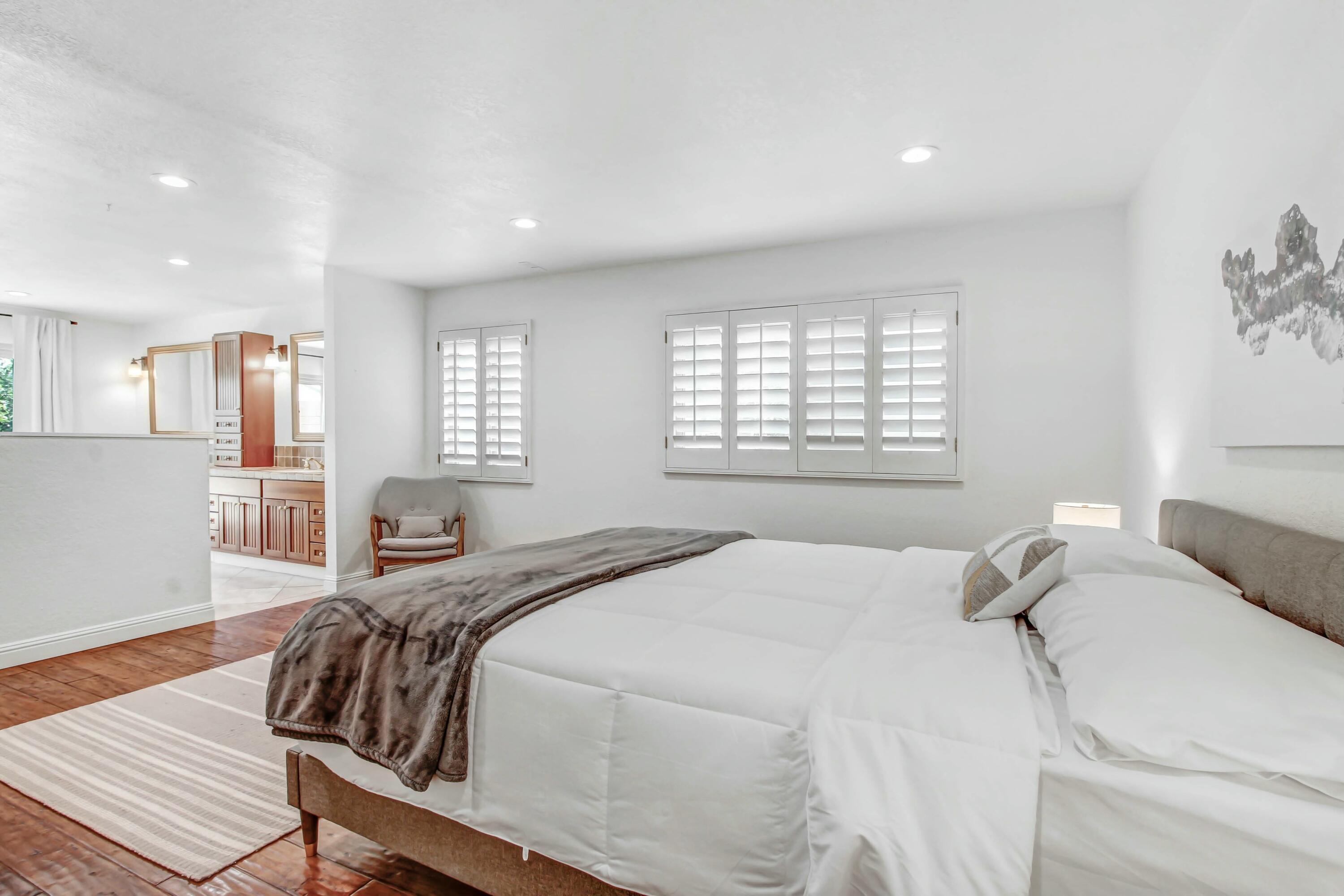 43480 Port Maria Road Bermuda Dunes, CA 92203 - Photo 12 of 24 a bedroom with a bed and wooden floor