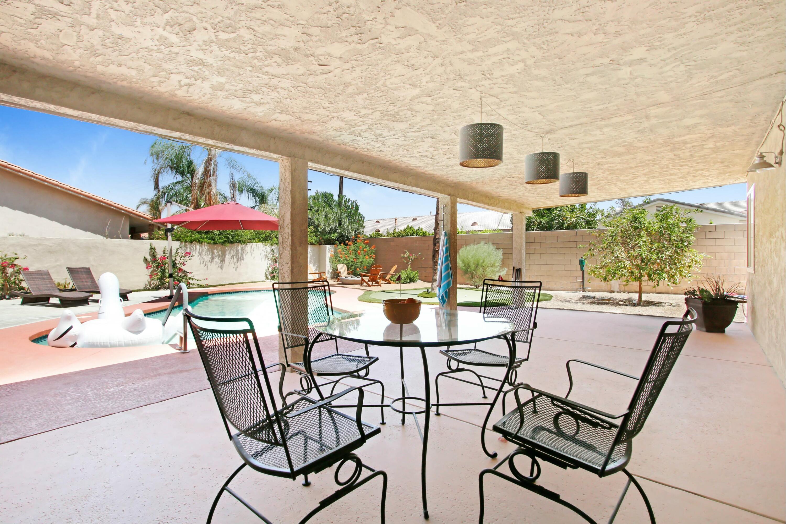 43480 Port Maria Road Bermuda Dunes, CA 92203 - Photo 16 of 24 a view of a patio with a table and chairs