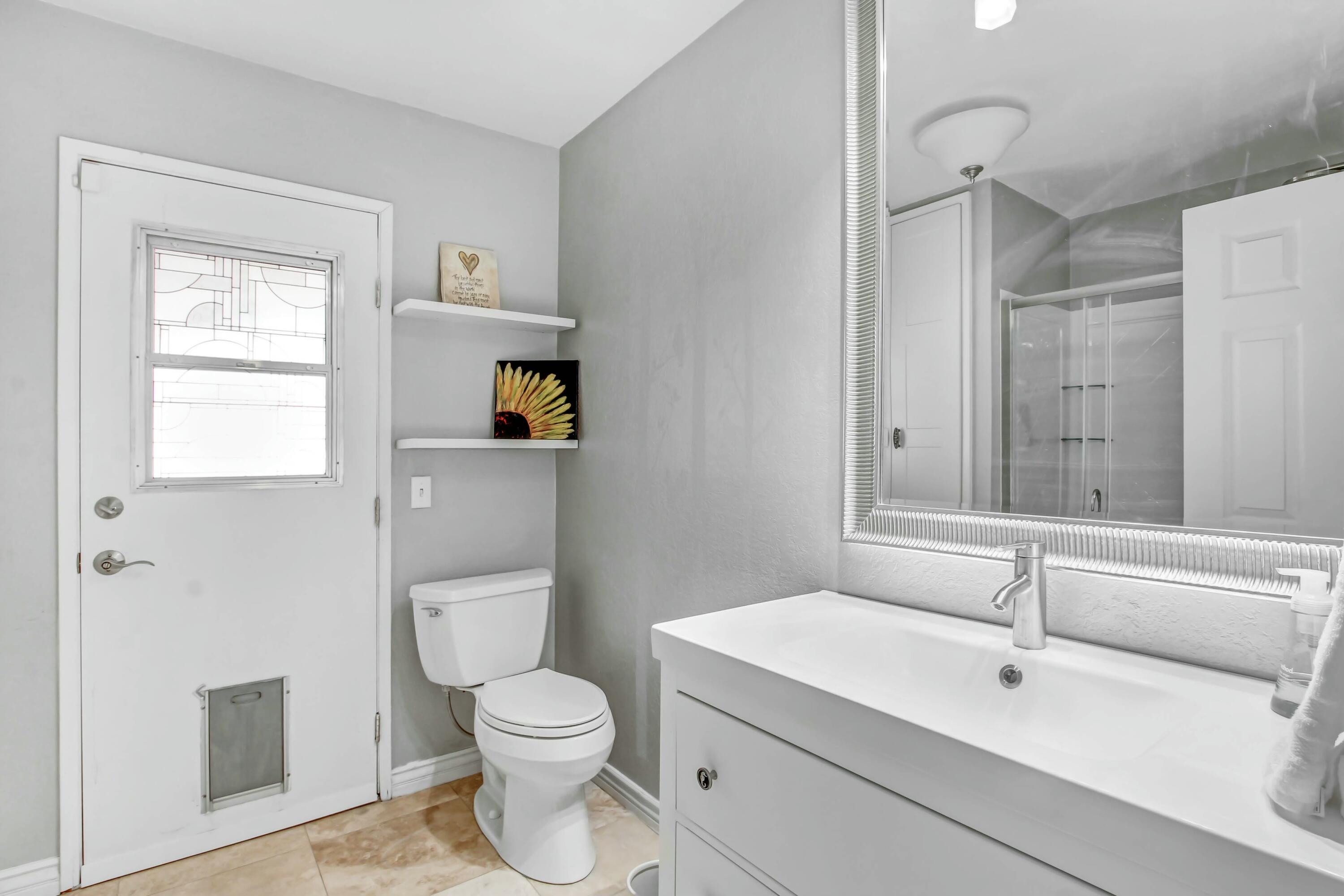 43480 Port Maria Road Bermuda Dunes, CA 92203 - Photo 22 of 24 a bathroom with a toilet sink vanity and mirror
