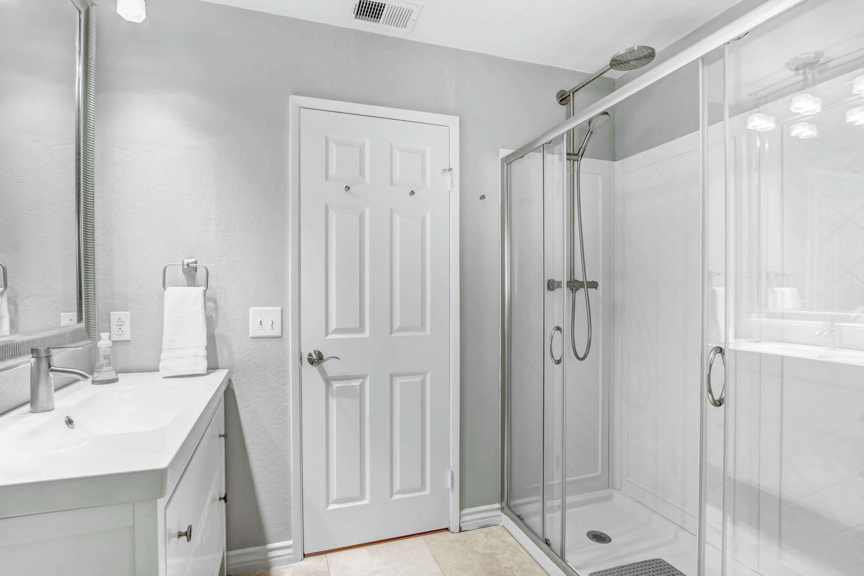 43480 Port Maria Road Bermuda Dunes, CA 92203 - Photo 23 of 24 a bathroom with a shower sink and mirror