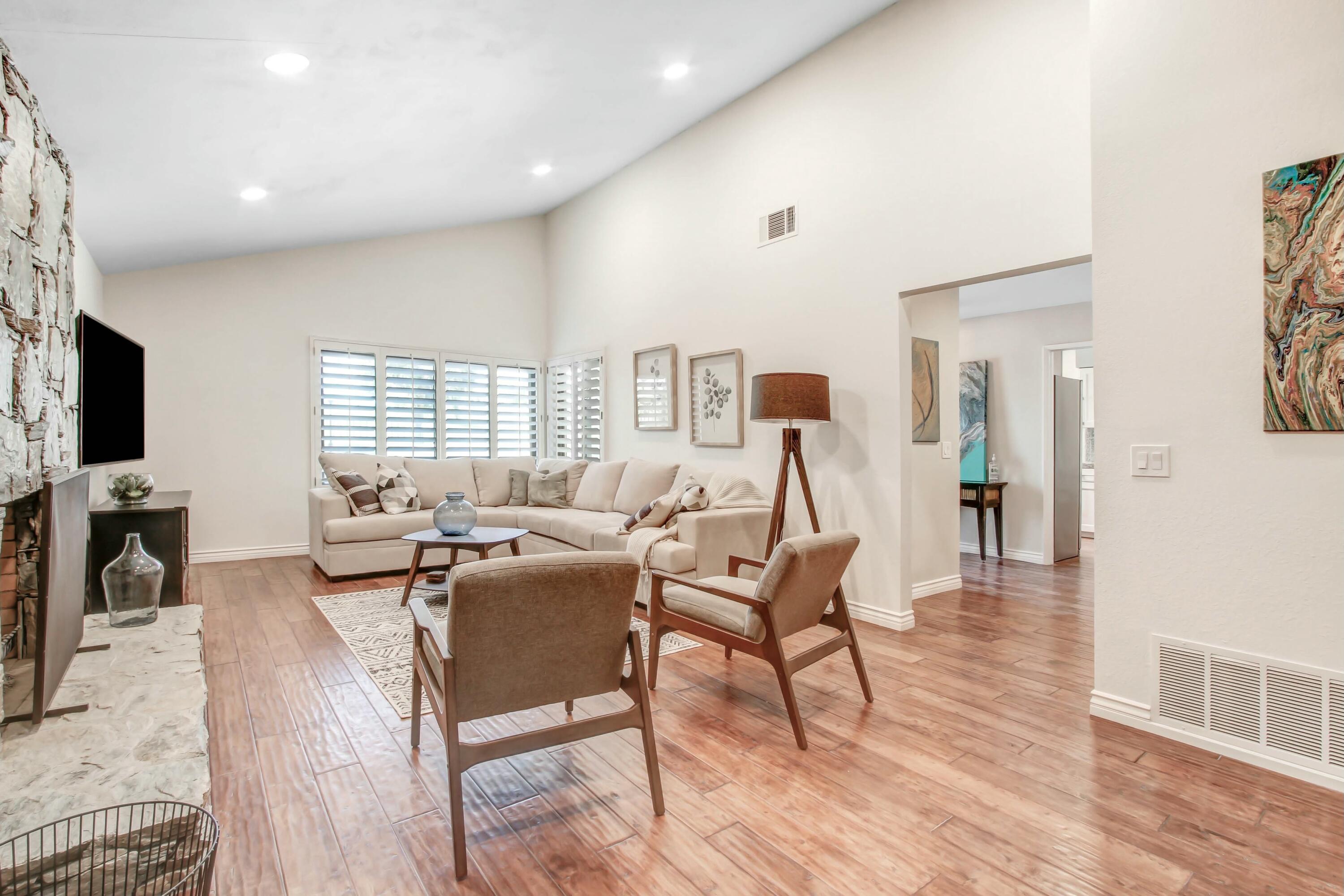 43480 Port Maria Road Bermuda Dunes, CA 92203 - Photo 5 of 24 a living room with furniture a wooden floor and a flat screen tv