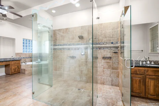 a bathroom with a sink a mirror and vanity