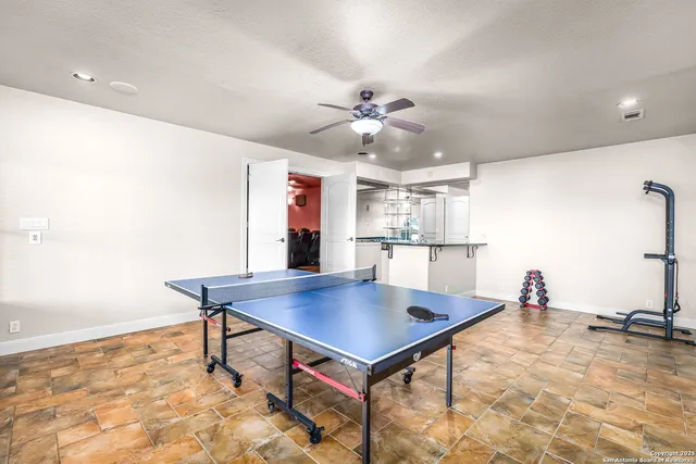 a kitchen with a counter top and white appliances