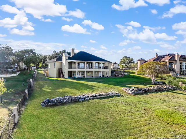 a view of a big garden with a house in the background