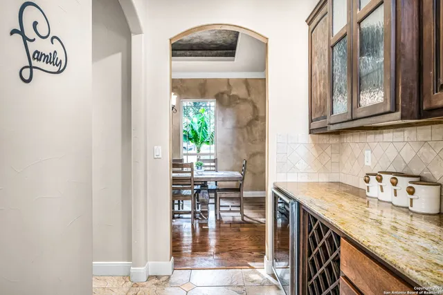 a kitchen with stainless steel appliances granite countertop a stove and a cabinets