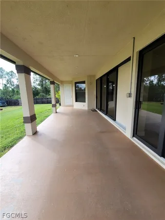 a view of a house with a yard and garage