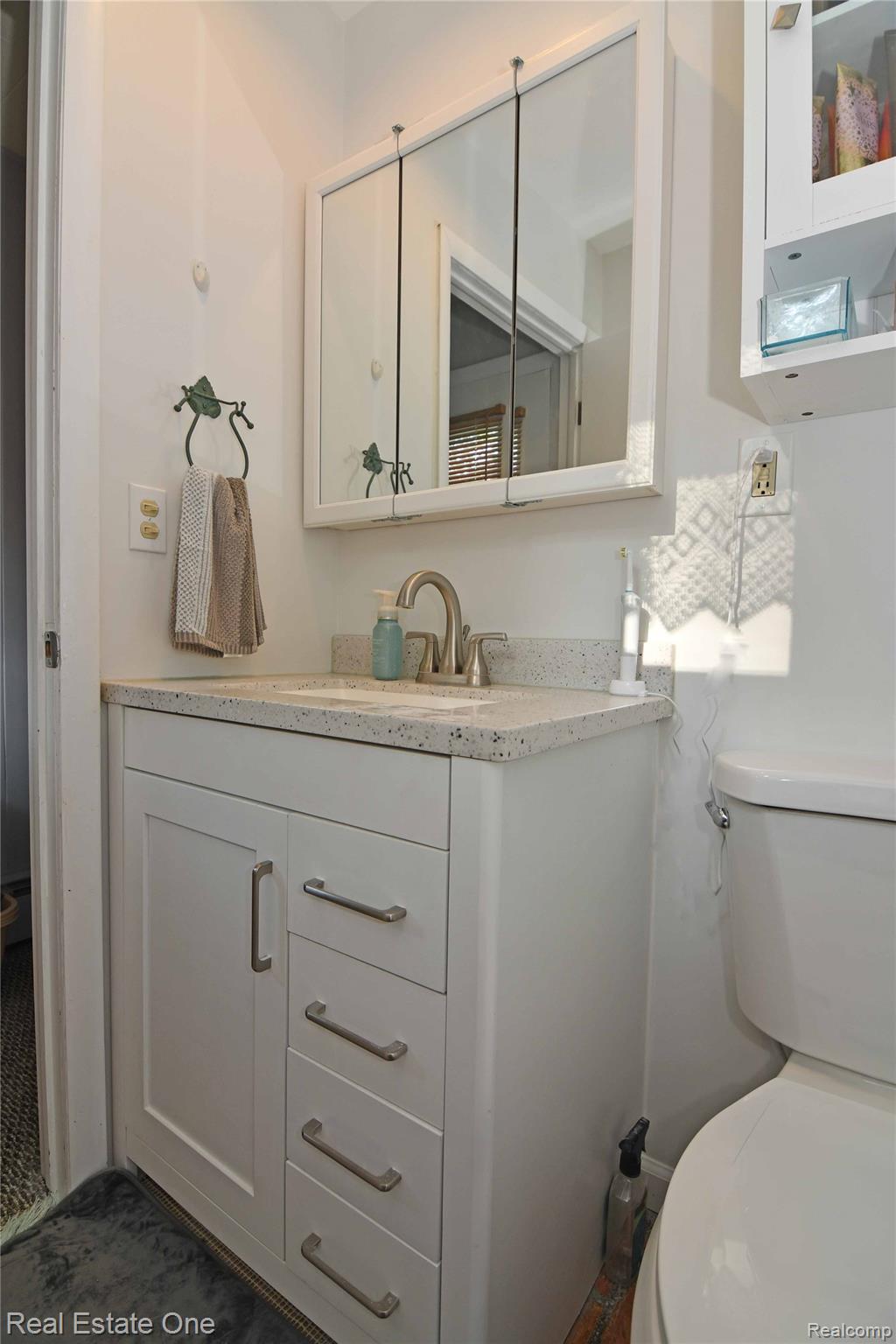 4255 Ash Road Lincoln, MI 48742 - Photo 29 of 41 White vanity in full Bath