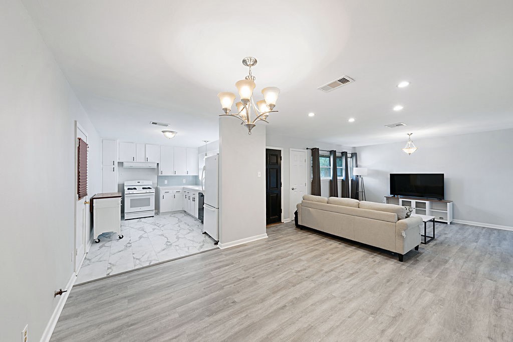 614 Gilpin Street Houston, TX 77034 - Photo 9 of 27 The home has an open concept living and dining experience.