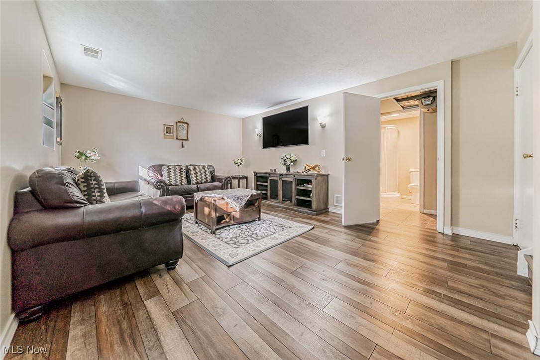 1489 Sunnyacres Road Akron, OH 44321 - Photo 14 of 33 Living room with wood finished floors and baseboards