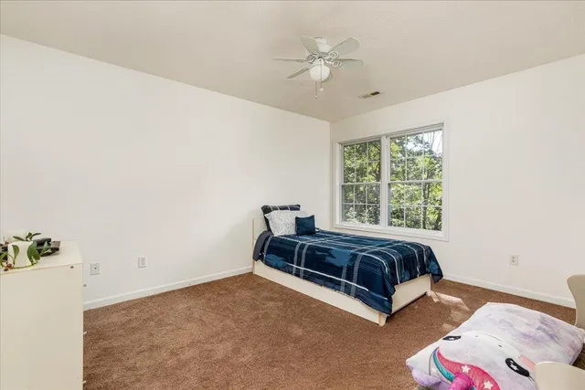 a bathroom with a sink mirror vanity and bathtub