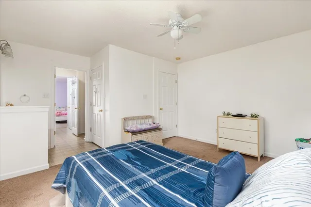 a bathroom with a granite countertop sink a mirror a vanity and a bathtub