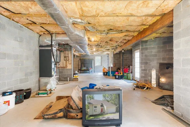 a view of a green field with lots of bushes