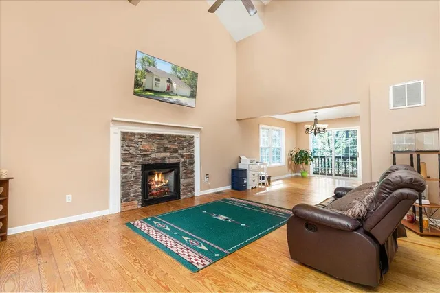 a view of a livingroom with furniture window and wooden floor