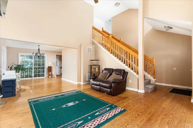 a living room with furniture rug and a fireplace
