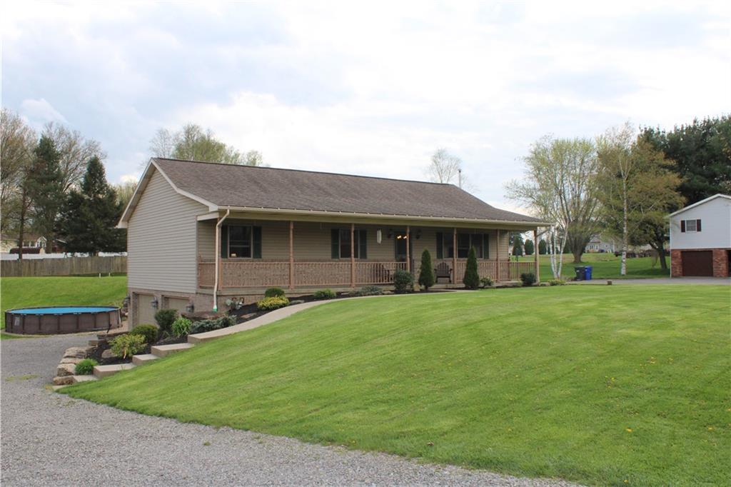 125 Shannon Road Renfrew, PA 16053 - Photo 1 of 39 a front view of a house with a garden