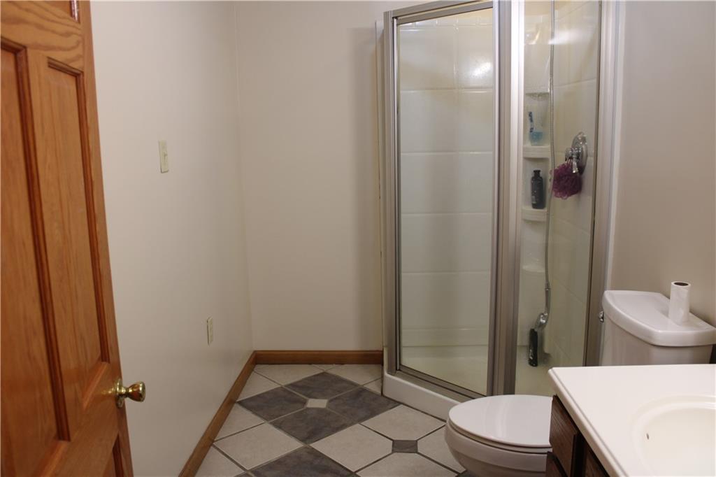 125 Shannon Road Renfrew, PA 16053 - Photo 24 of 39 a bathroom with a granite countertop sink toilet and shower