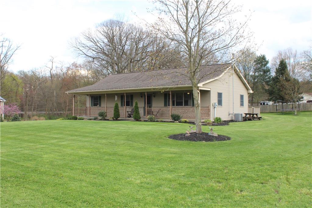 125 Shannon Road Renfrew, PA 16053 - Photo 29 of 39 a front view of a house with a garden