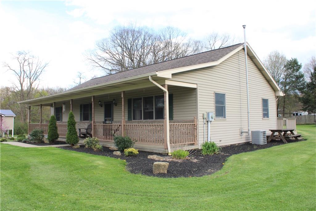 125 Shannon Road Renfrew, PA 16053 - Photo 4 of 39 a front view of a house with a garden and yard
