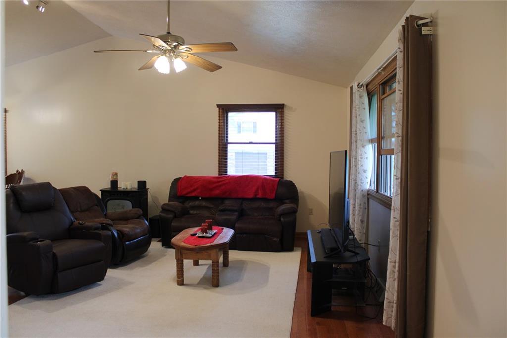 125 Shannon Road Renfrew, PA 16053 - Photo 6 of 39 a living room with furniture and a chandelier