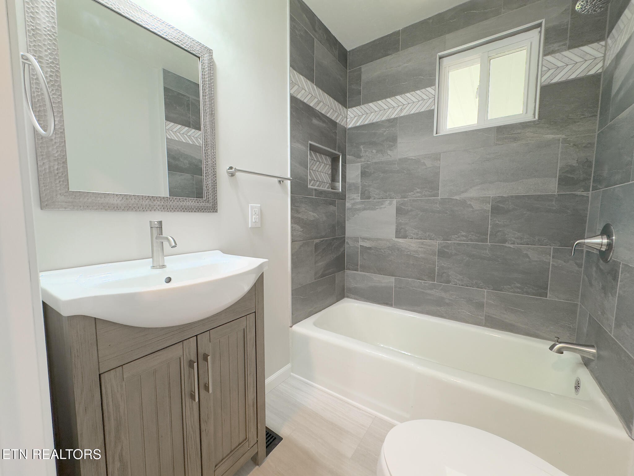 150 Connor Street Jacksboro, TN 37757 - Photo 12 of 22 a bathroom with a sink a toilet and bathtub