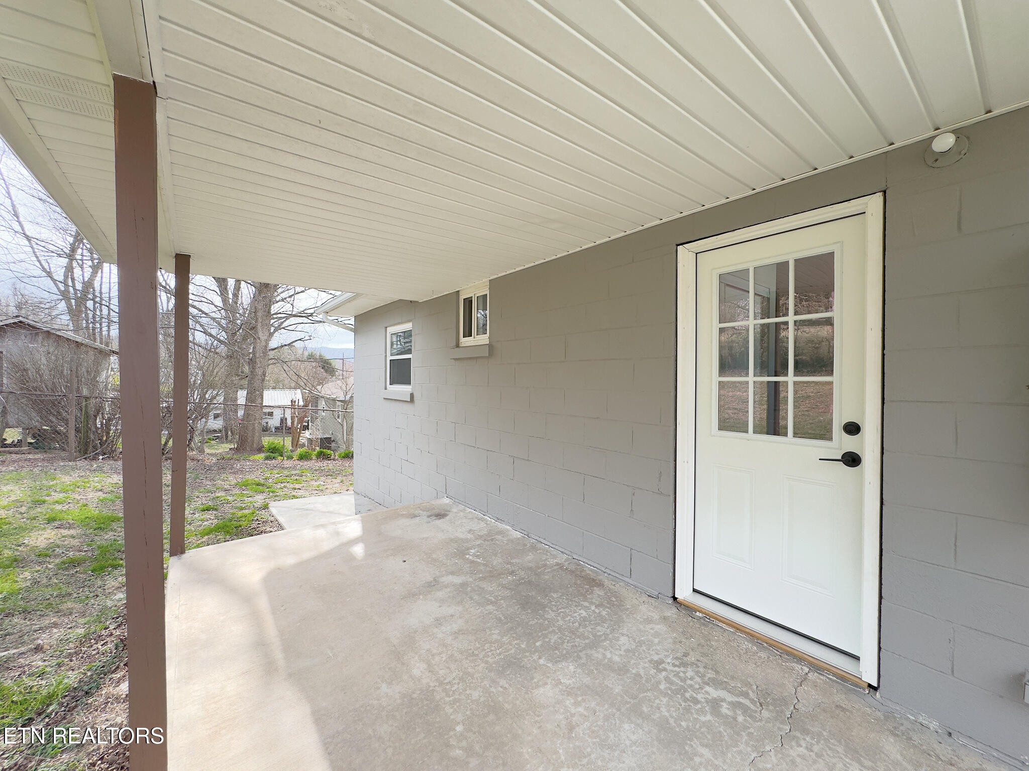 150 Connor Street Jacksboro, TN 37757 - Photo 15 of 22 a view of a porch with a table and chairs