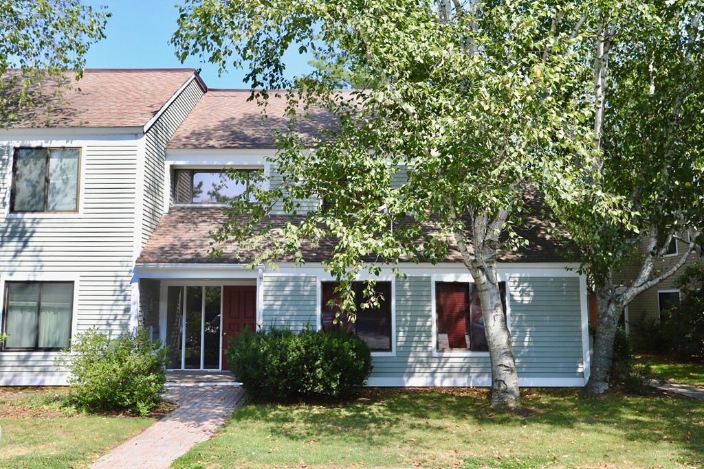 29 Concord Greene, Unit 8 Concord, MA 01742 - Photo 1 of 1 a front view of a house with a yard