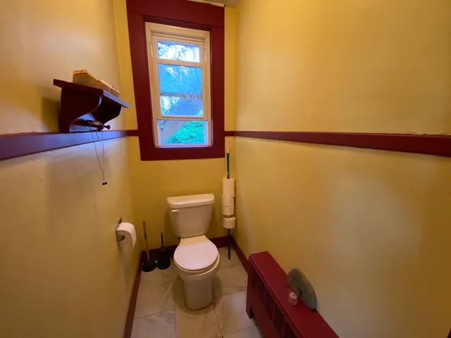 a bathroom with a toilet and a sink