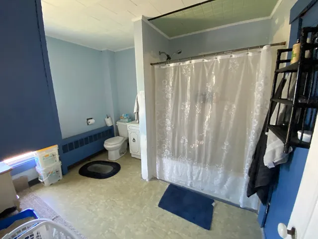 a view of entryway with furniture and rug