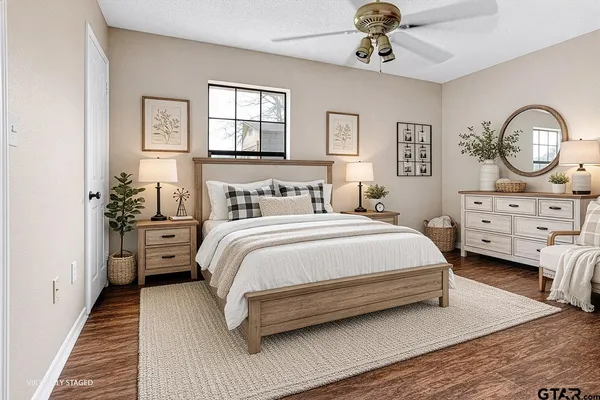 a bedroom with bed and a chandelier
