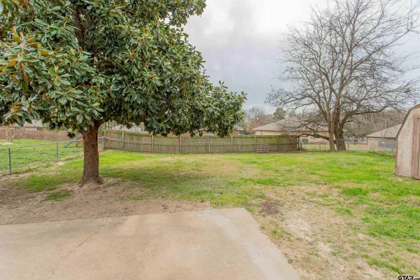 a view of backyard with cabin