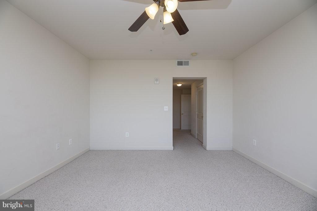 485 Harbor Side Street, Unit 710 Woodbridge, VA 22191 - Photo 15 of 26 a view of a room with a ceiling fan and window