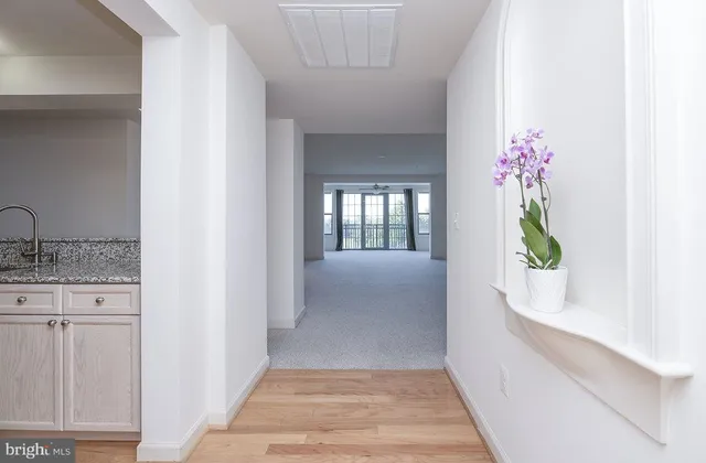 a hallway with sliding door and yard