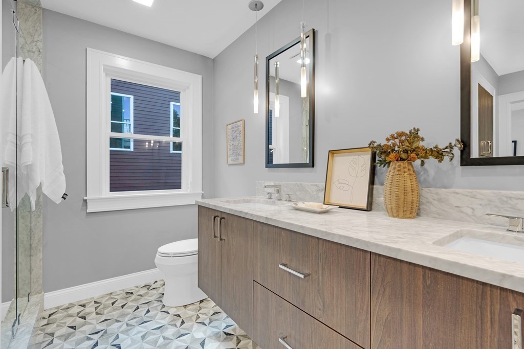 87 Parkton Road, Unit 2 Boston, MA 02130 - Photo 17 of 37 a bathroom with a sink and a mirror