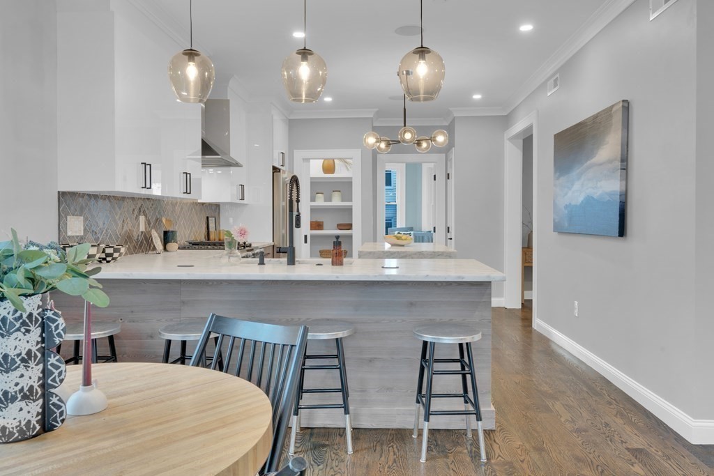 87 Parkton Road, Unit 2 Boston, MA 02130 - Photo 8 of 37 a kitchen with sink table and chairs
