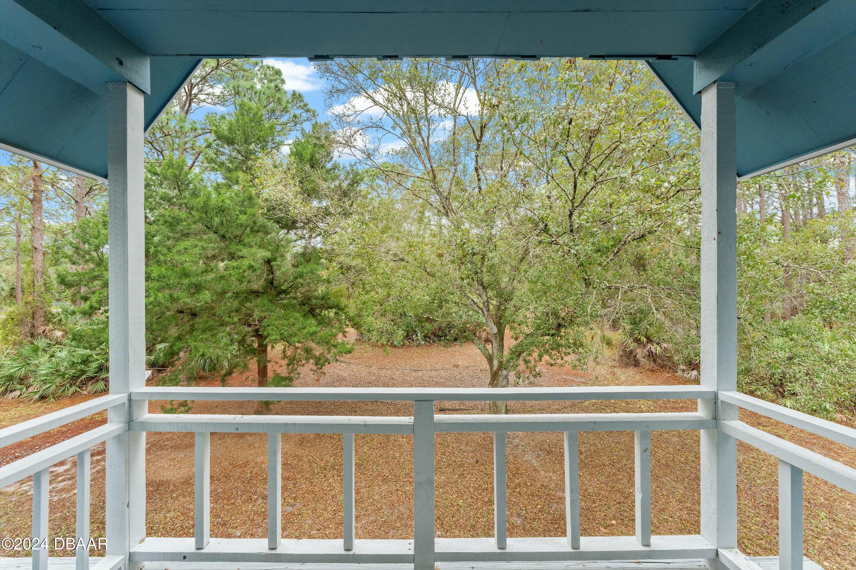 1681 Emmaus Road Northwest Palm Bay, FL 32907 - Photo 29 of 34 a view of a green trees from a window