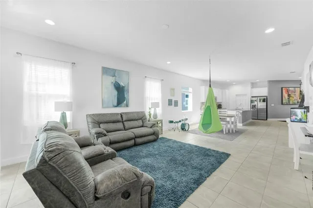 a bathroom with a granite countertop double vanity sink and a mirror