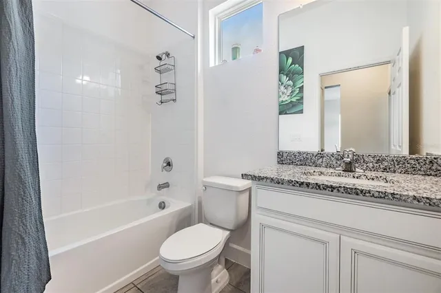 an aerial view of a house with a swimming pool