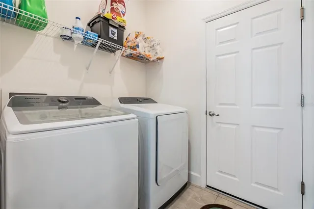 an aerial view of a house with a swimming pool