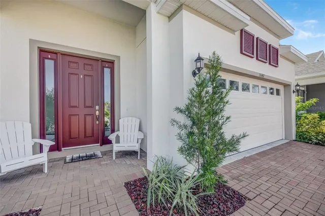 a view of front door with outdoor seating