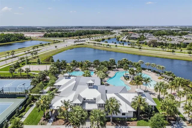 an aerial view of a house with a swimming pool