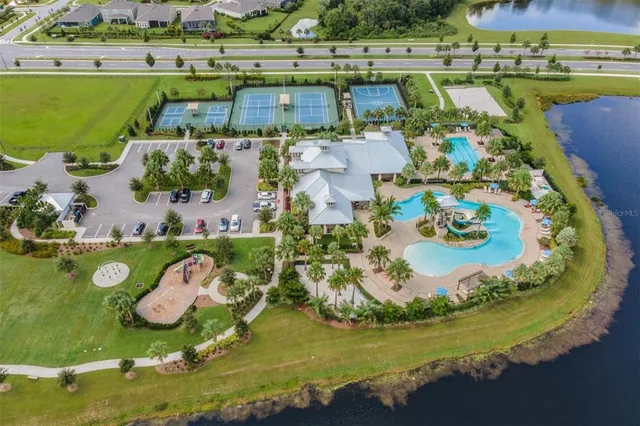 an aerial view of a house with a lake view