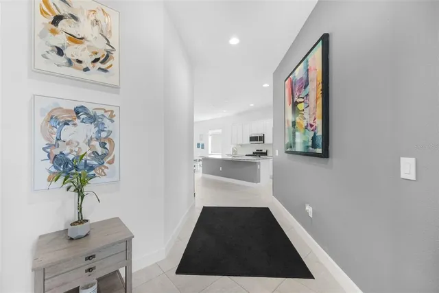 a kitchen with granite countertop a sink a counter top space cabinets and stainless steel appliances