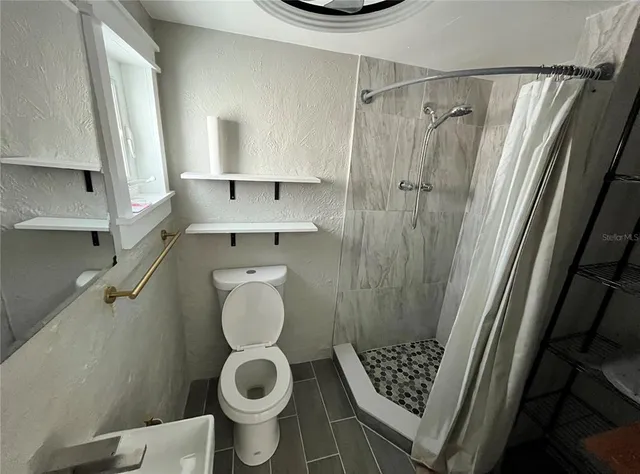 a bathroom with a toilet and a sink