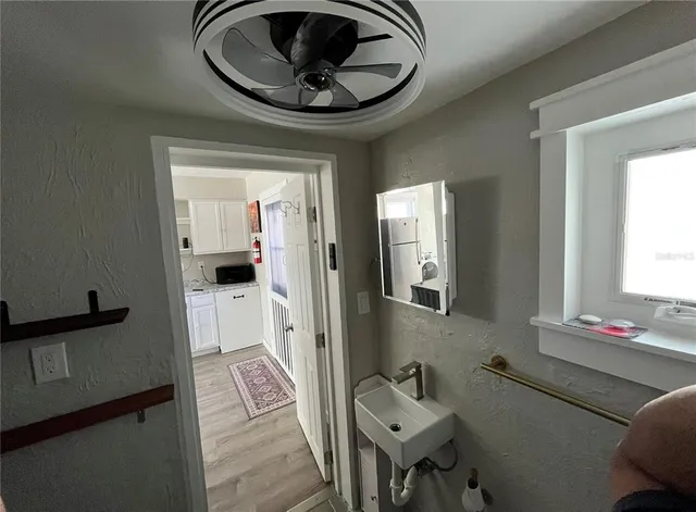 a bathroom with a sink and a mirror