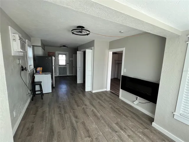a view of a hallway view with wooden floor and staircase