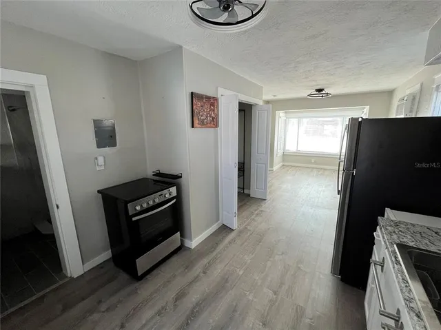 a view of a livingroom with wooden floor