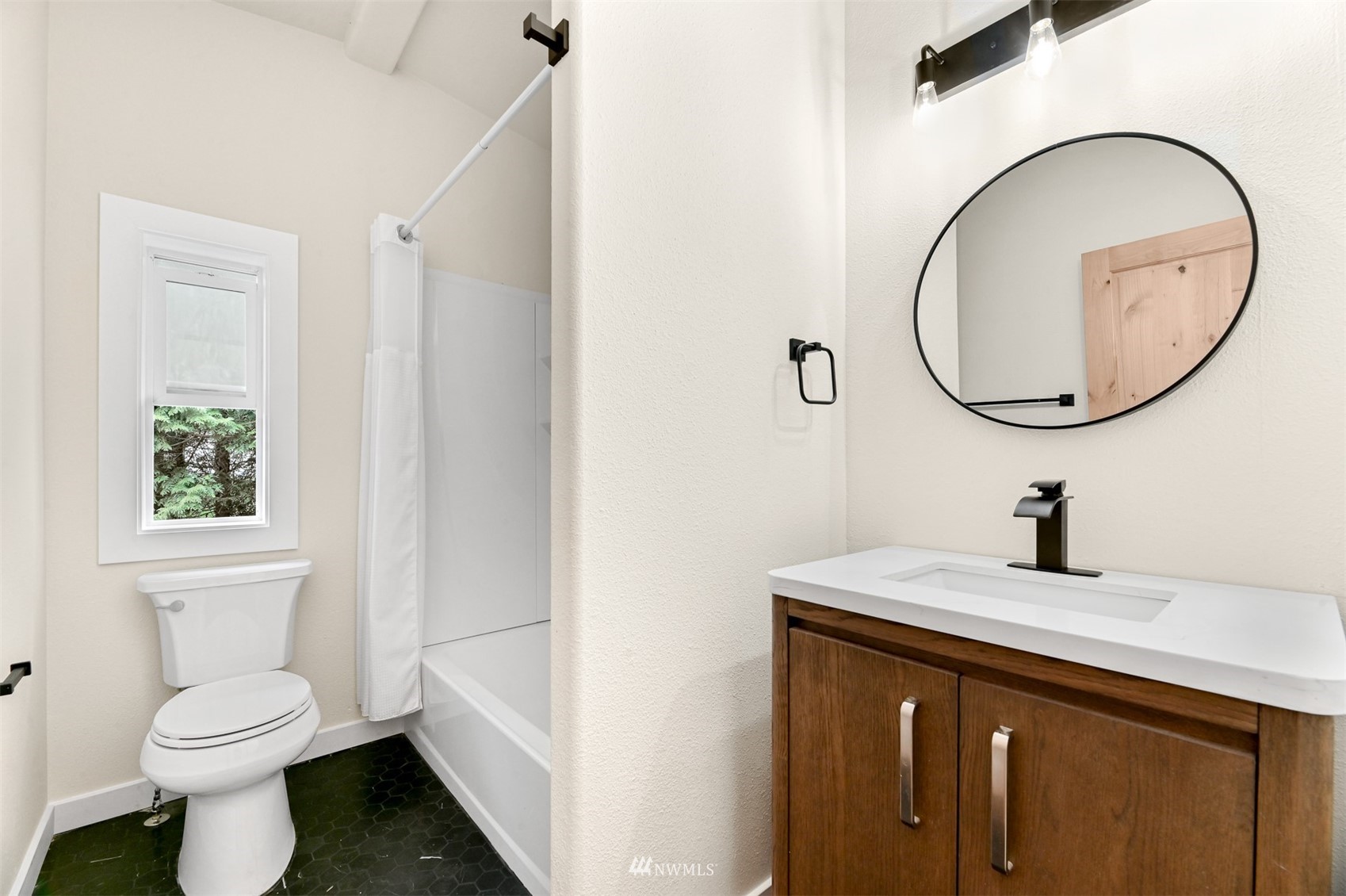 4423 Masterson Road Birch Bay, WA 98230 - Photo 14 of 20 a bathroom with a sink a toilet and a mirror