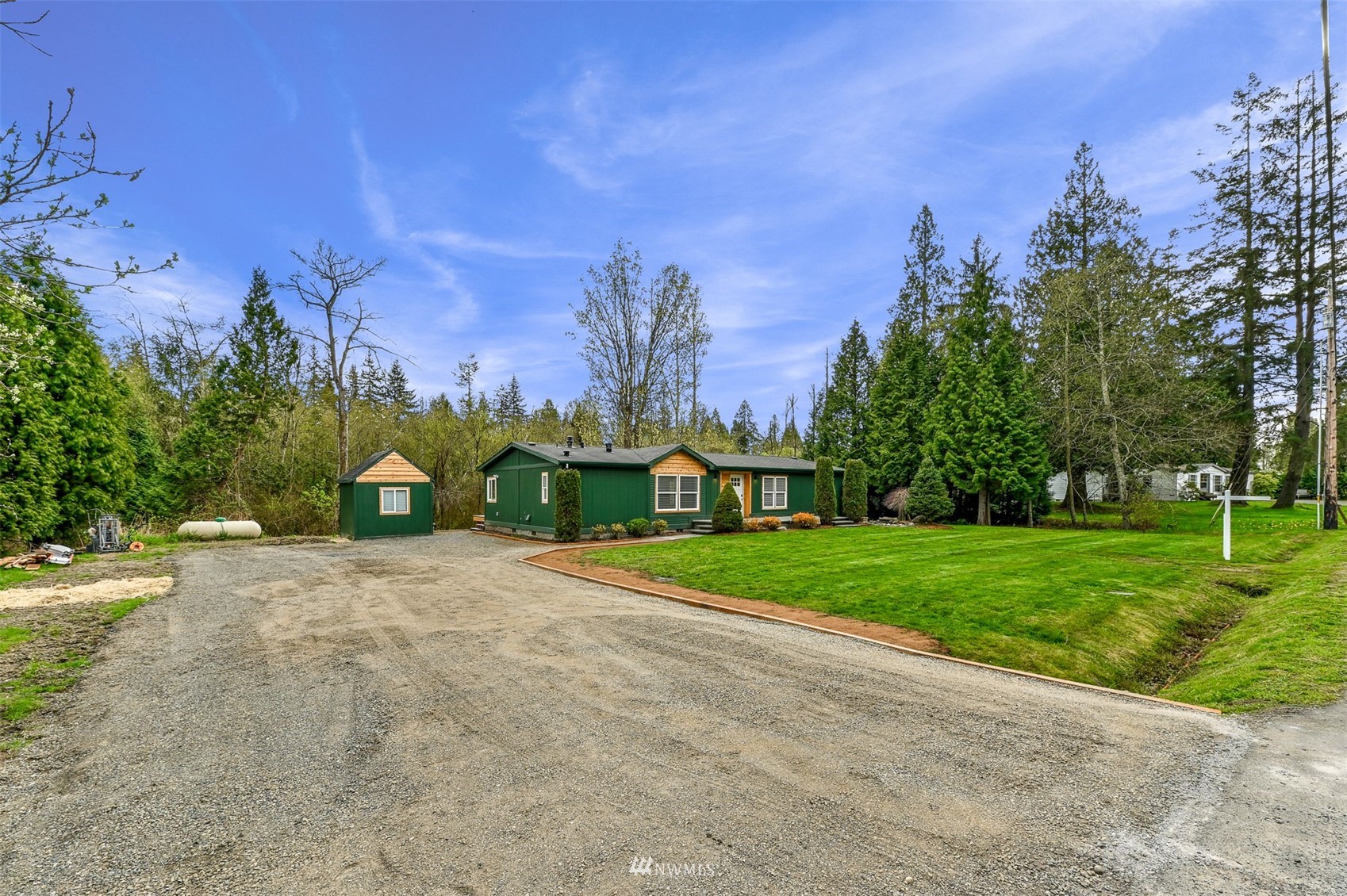 4423 Masterson Road Birch Bay, WA 98230 - Photo 3 of 20 a view of a house with a big yard and large trees