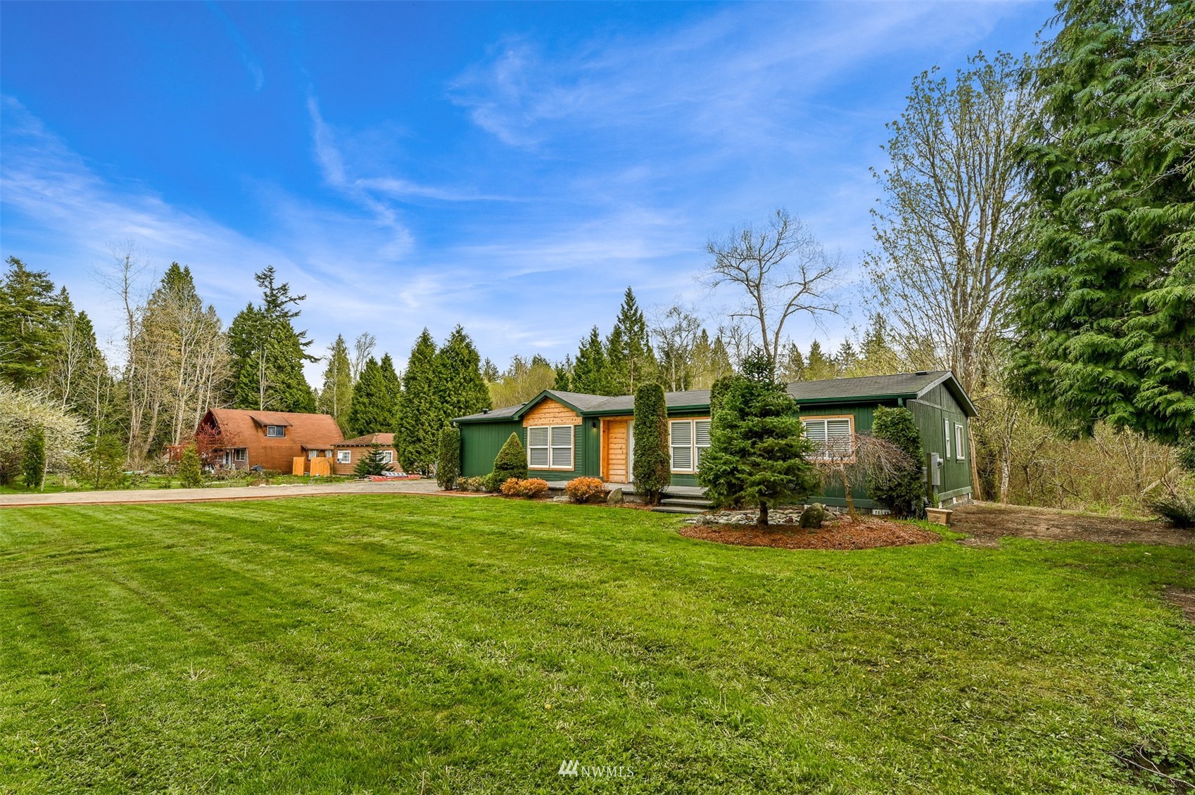 4423 Masterson Road Birch Bay, WA 98230 - Photo 5 of 20 a front view of a house with a yard table and seating